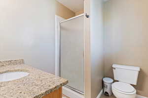 Bathroom with vanity and a shower stall