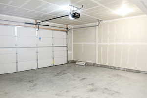 Garage featuring a garage door opener