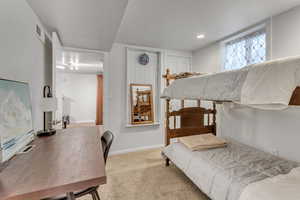 Carpeted bedroom with baseboards and recessed lighting