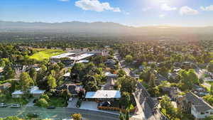 Aerial perspective of suburban area featuring a mountain backdrop