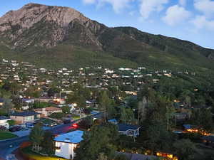 View of mountain backdrop featuring nearby suburban area