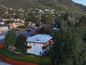 Aerial perspective of suburban area featuring a mountainous background