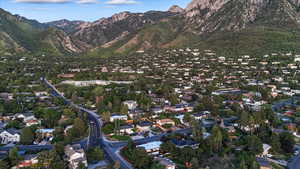 View of property location with mountains and nearby suburban area