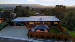 View of front of house featuring a fenced front yard and a mountain view