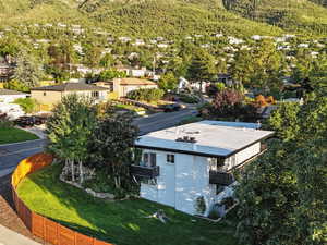 Aerial perspective of suburban area with a mountainous background