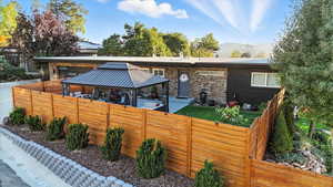 View of front of home with a gazebo and stone siding