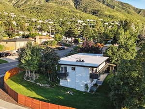 Aerial perspective of suburban area featuring a mountain backdrop