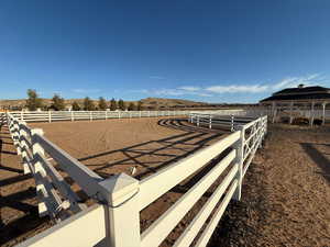 View of yard with an outdoor riding arena, a view of rural / pastoral area, and a mountain view