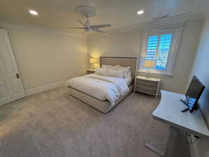 Carpeted bedroom featuring crown molding, recessed lighting, and a ceiling fan