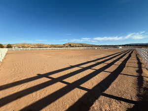 View of yard with an enclosed horse arena and a view of countryside