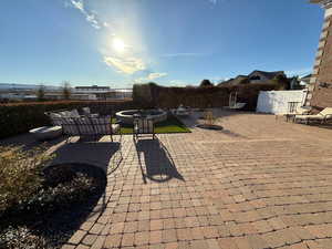 View of patio featuring an outdoor fire pit