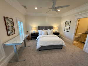 Bedroom featuring ornamental molding, carpet floors, recessed lighting, ensuite bath, and a ceiling fan