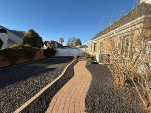 Fenced backyard with a residential view