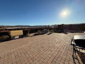 View of patio featuring a mountain view and area for grilling