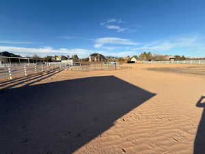 View of yard featuring an enclosed riding area