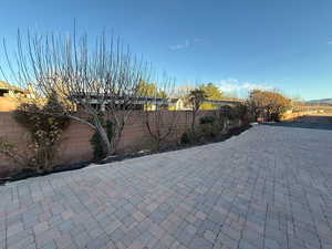 Fenced backyard featuring a patio
