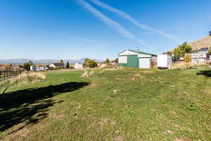 View of yard with barn