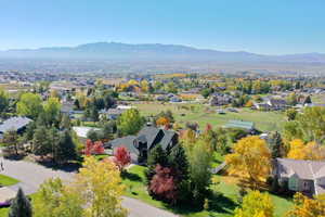 Aerial perspective of suburban area featuring a mountain backdrop