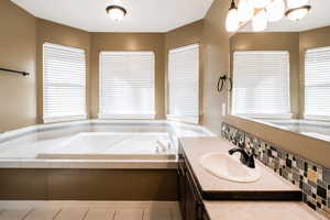 Bathroom with vanity and a garden tub