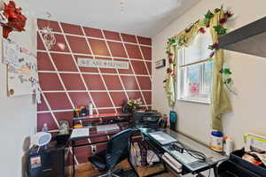 Office featuring an accent wall