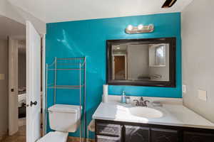 Ensuite bathroom featuring vanity and a textured ceiling