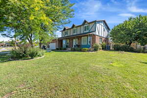 Tudor-style house with brick siding