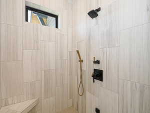 Full bathroom with a tile shower