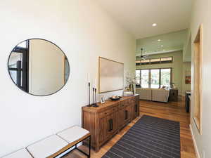 Corridor featuring light wood finished floors and recessed lighting