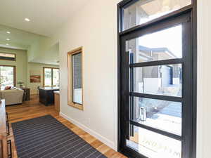 Interior space with wood finished floors and recessed lighting