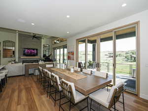 Dining area featuring recessed lighting, wood finished floors, ceiling fan, and a fireplace