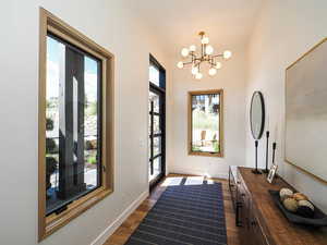 Entryway featuring a chandelier and dark wood finished floors