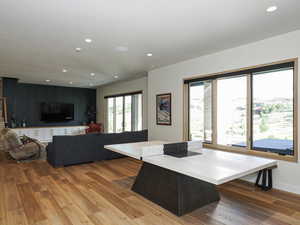 Living area featuring wood finished floors and recessed lighting