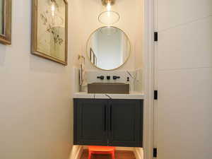 Bathroom with vanity and wood finished floors