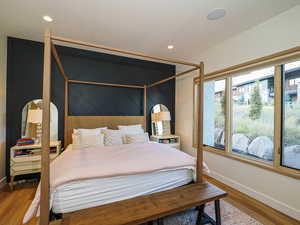 Bedroom featuring wood finished floors and recessed lighting
