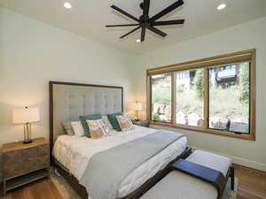 Bedroom featuring wood finished floors, recessed lighting, and a ceiling fan