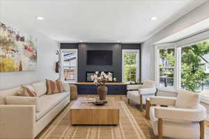 Living area featuring light wood-type flooring and recessed lighting