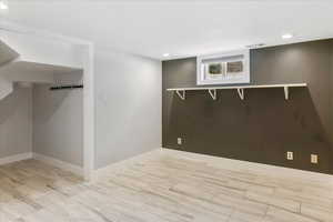 Basement with recessed lighting and baseboards