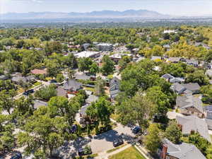 Aerial perspective of suburban area featuring a mountainous background