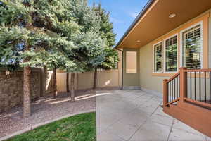 Fenced backyard featuring a patio