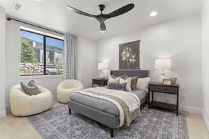 Carpeted bedroom with recessed lighting and a ceiling fan