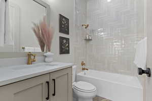 Full bathroom featuring vanity and shower / bath combination