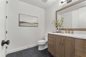 Bathroom with vanity and tile patterned flooring