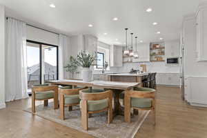 Dining space featuring recessed lighting and light wood finished floors