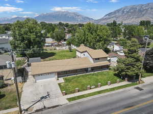 Aerial view of residential area featuring a mountainous background