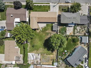 Aerial view of property's location with nearby suburban area