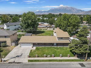 Aerial perspective of suburban area with a mountainous background