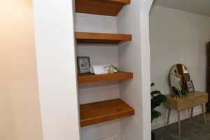 Detailed view of a textured wall and carpet flooring