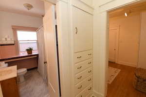 Corridor featuring baseboards