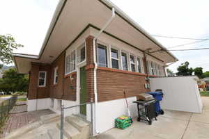 View of property exterior featuring entry steps