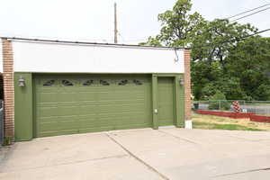 Garage featuring driveway